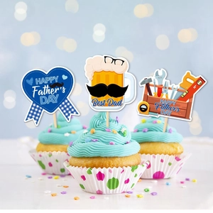 Father's Day cupcake toppers featuring beer, tools, and Best Dad heart on green frosting