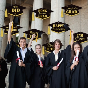 Graduation party decorations set with gold glitter graduation cap tags and yellow tassels