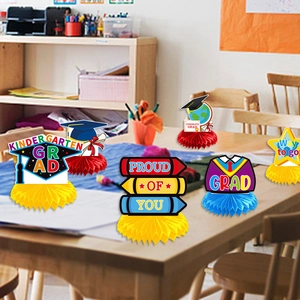 Kindergarten graduation honeycomb centerpieces with mortarboard and star designs