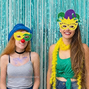 Detail of glitter Mardi Gras party masks with crown designs and vibrant sequins