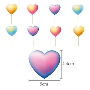 Detail view showing 5cm heart-shaped rainbow gradient toppers for cake and party decoration