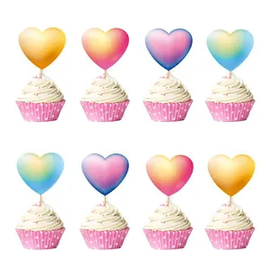 Close-up of heart-shaped balloon cupcake toppers in gradient colors for party decor