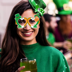 St. Patrick's Day themed heart clover glasses and mini hat headband for festive party decor