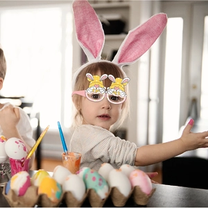 Pink Easter gnome glasses for kids used as a festive party photo prop with rabbit ears