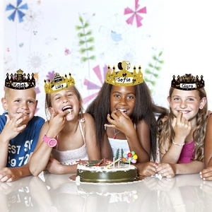 Kids wearing 2026 Happy New Year crown party hats in black and gold glitter finish