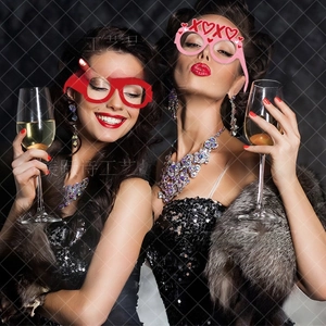 Models wearing paper Love and Xoxo glasses for Valentine party photo booth props