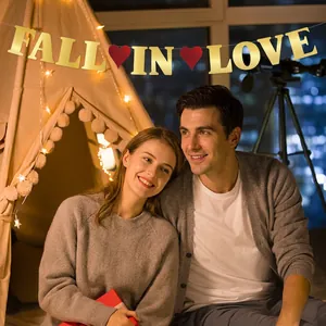 Golden Fall In Love banner with red hearts for romantic Valentine decoration