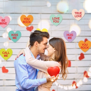 Colorful heart hanging ornaments set with romantic phrases for Valentine's Day decor