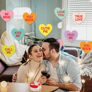 Colorful Valentine's Day heart hanging ornaments with romantic phrases for party decor