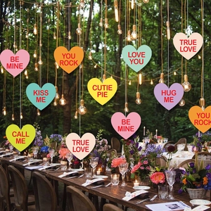 Conversation heart hanging decorations for Valentine's Day party and romantic garden setup