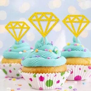 Gold glitter diamond cupcake toppers on light blue frosting for wedding and party decor