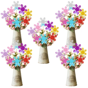 Colorful glitter snowflake cake toppers with blue bows for Christmas party decorations