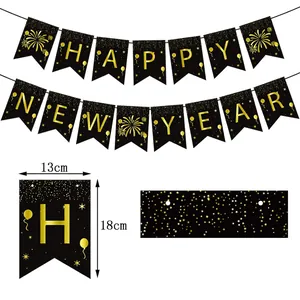Gold foil Happy New Year banner set with black flags and elegant star and firework details