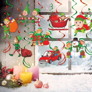 Close-up of colorful Christmas swirls and cartoon pendants against a snowy window scene