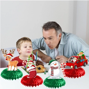 Christmas honeycomb centerpieces featuring Santa and reindeer on a festive table