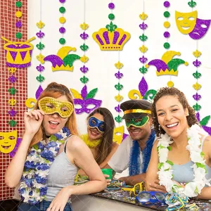 Detail view of colorful Mardi Gras sequin hanging decorations at a lively indoor party