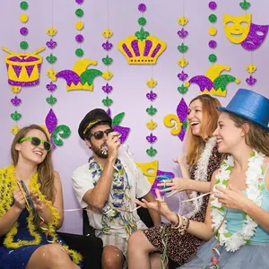 Mardi Gras party decoration set with glitter masks and crowns in gold green and purple