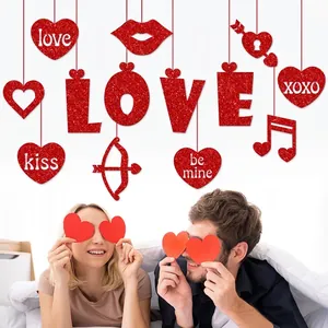 Glittery red Love heart hanging decorations for Valentines Day proposal and party