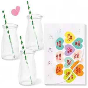 Colorful Valentine heart stickers with romantic phrases on glass jars for party decor
