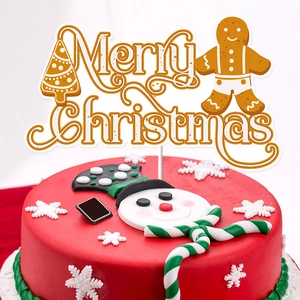 Golden Merry Christmas cake topper with gingerbread man on a festive snowman cake