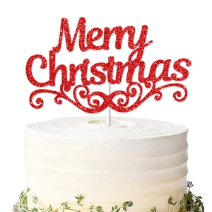 Red glitter Merry Christmas cake topper with spiral patterns on white cream cake