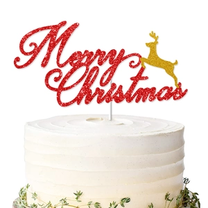 Red and gold glitter Merry Christmas cake topper with a reindeer on a white cream cake