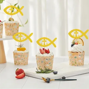 Golden glitter fish cross cupcake toppers and decorative paper liners for baptism party