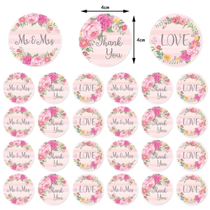 Detail of 4cm floral wedding stickers featuring Mr & Mrs, Thank You and Love text