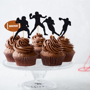 Rugby theme cake toppers featuring black glitter silhouettes on chocolate cupcakes