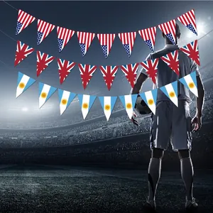 32 nation World Cup triangular bunting flags displayed against a football stadium background