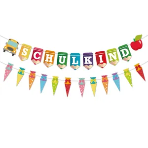 Colorful Schulkind banner with pencil shapes and paper cones for school start party