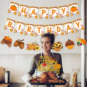Autumn birthday party set with pumpkin banners and golden cake topper decorations