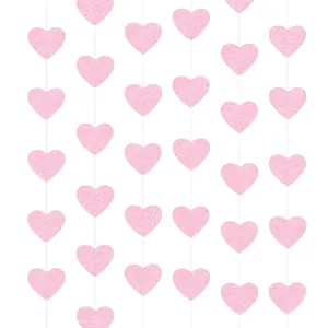 Detail of pink glitter heart garland with shiny sequins for wedding party decor