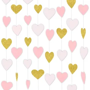 Close-up of pink and gold glitter heart garland for wedding and party decorations