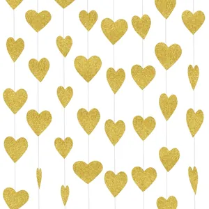 Close-up of glittery gold heart banner garland for wedding and party decoration