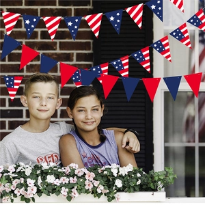 Fourth of July USA party banner with stars and stripes pennants for festive wall decoration