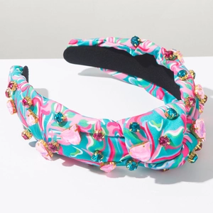 Detailed view of tie-dye knotted headband with vibrant colorful rhinestones and crystals