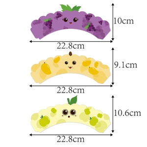 Three fruit-themed cupcake wrappers in grape, mango, and apple designs with dimensions