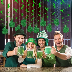 Glittery St. Patrick's Day shamrock swirl decorations set for Irish party atmosphere