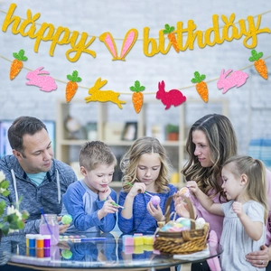 Glittery Happy Birthday banner with Easter bunny and carrot decorations for party