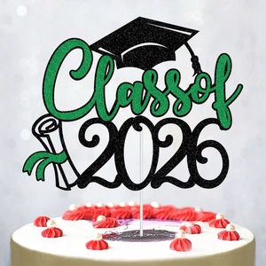 Sparkly Class of 2026 graduation cake topper with green glitter diploma and cap