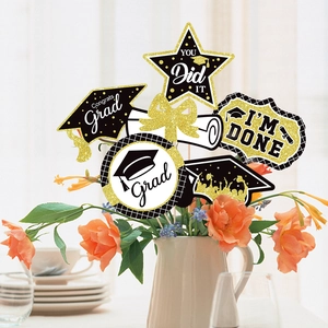 Black and gold graduation party centerpieces with Congrats Grad and You Did It signs