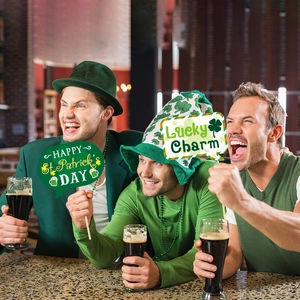 St. Patrick's Day party photo booth props set with green beer and clover designs