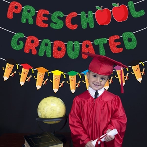 Colorful Preschool Grad banner with glitter letters and cartoon pencil bunting for classroom