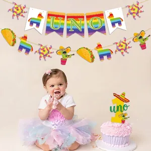 Fiesta themed first birthday party set with UNO banner and cactus cake topper decorations