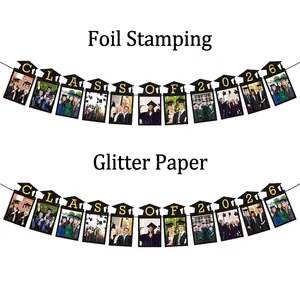 2026 Graduation Banner with gold Class of 2026 text and photo clips for party decor