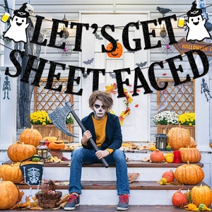 Halloween Let's Get Sheet Faced banner with glitter letters and ghost party decorations