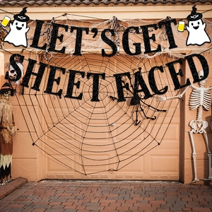 Close-up of Halloween glitter banner with Lets Get Sheet Faced text and ghost icons