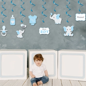 Blue elephant baby shower party hanging swirl decorations with 'It's a BOY' card tags