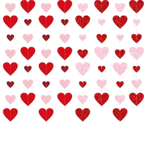 Close-up of glittery red and pink heart garland with matte and sequin finish heart shapes